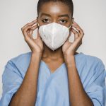 black-female-doctor-putting-medical-mask-on-face-6303589-683x1024.jpg